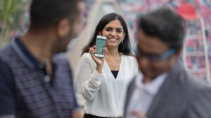 woman holding up mobile smartphone